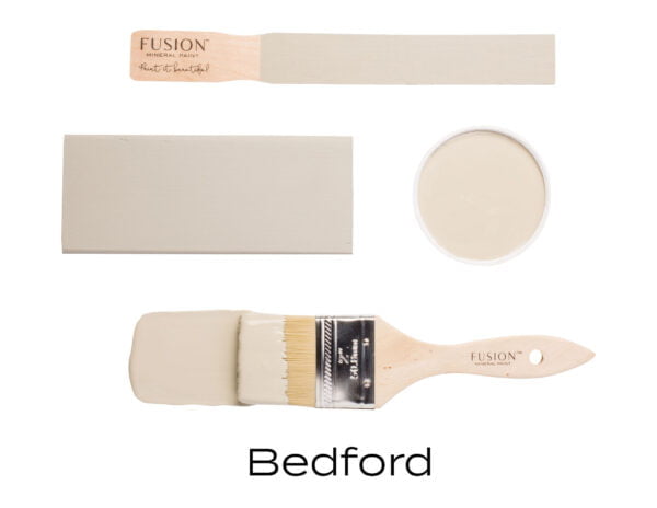 Colour swatches and paintbrush dipped in Bedford Fusion Mineral paint.