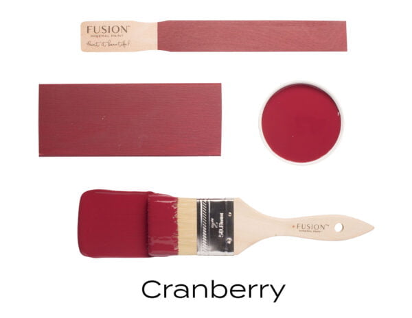 Colour swatches and paintbrush dipped in Cranberry Fusion Mineral paint.