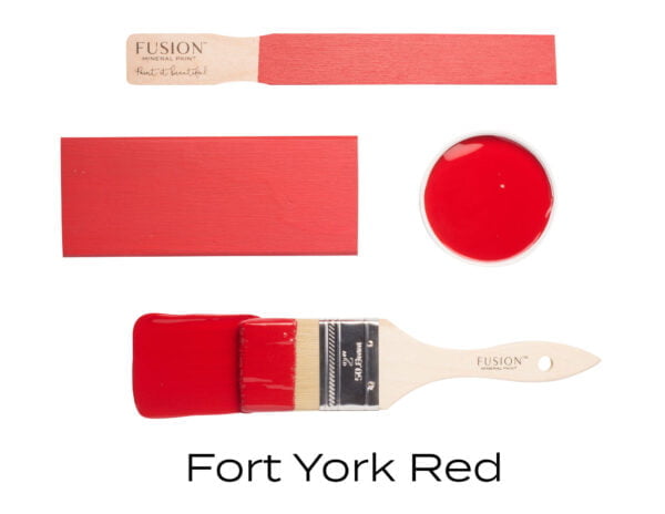 Colour swatches and paintbrush dipped in Fort York Red Fusion Mineral paint.