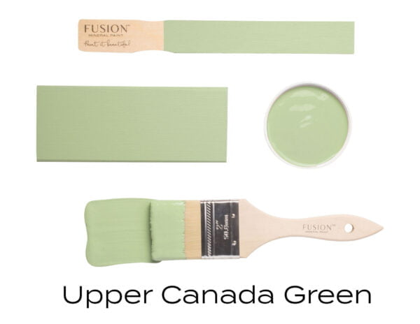 Colour swatches and paintbrush dipped in Upper Canada Green Fusion Mineral paint.