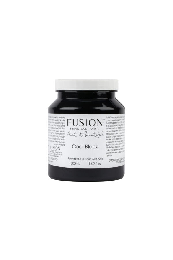 A pint of Fusion Coal Black showing label with size and weight.